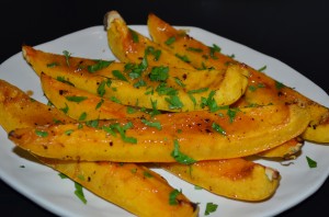 Wedges of roasted delicate squash with parsley