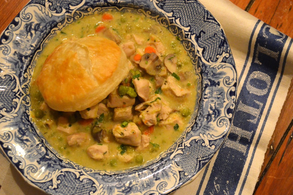 Chicken à la King in a blue willow bowl with a circle of puff pastry on top