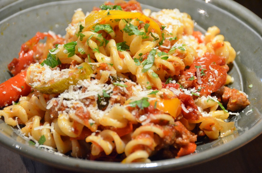 close up bowl of pasta with sauce mixed in